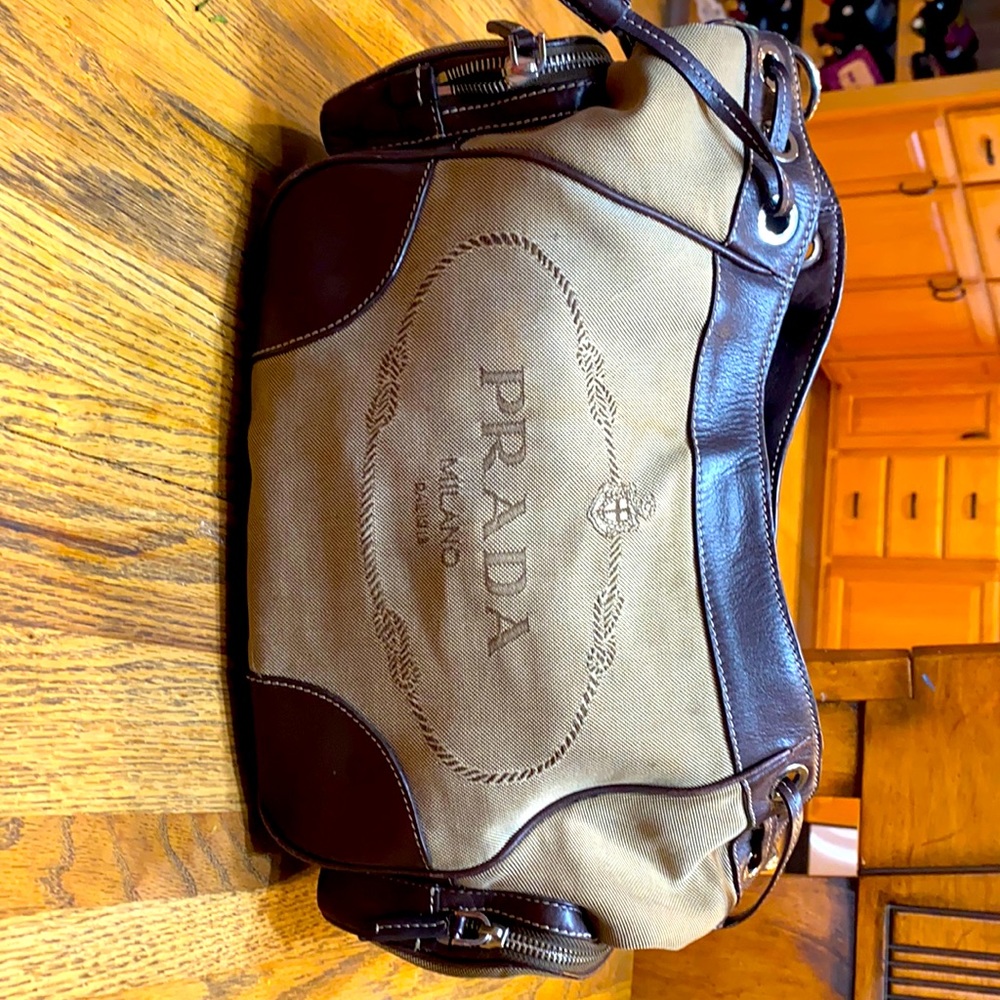 Gently used Genuine Logo Prada Jacquard hobo bag.